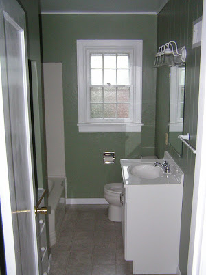 Before: Bathroom with green paint