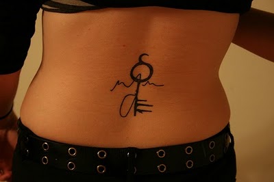 Sexy girls lower back tattoos with tribal key tattoo