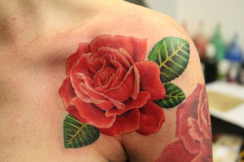 Red roses tattoos design in a sexy shoulder girl