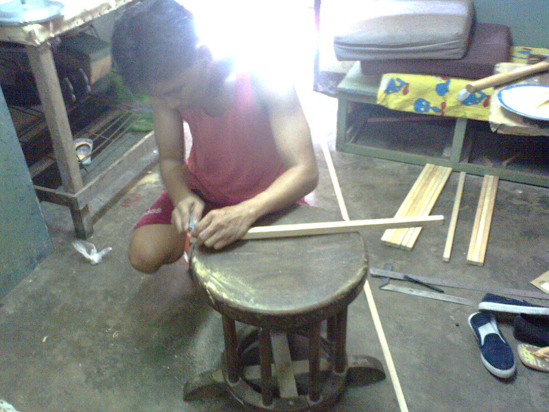 Trimming wood ends with a saw.