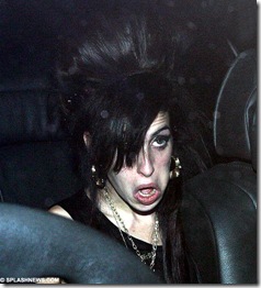 Amy Winehouse tries to smarten herself up to visit Blake in the back of a car 4