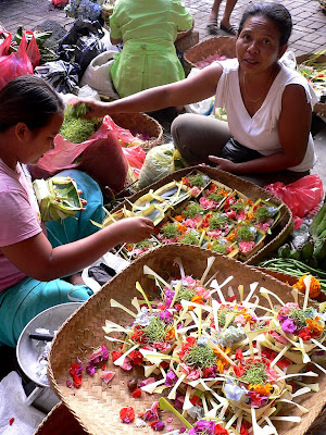 Canang sellers, offerings in tiny woven coconut leaf baskets