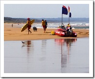 look back a little under the back of the surfboard