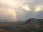 Rainbow over broad landscape. 