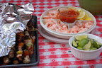 Delicious barbecue kabobs, limes and shrimp. 