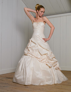  White ivory wedding gown  with side rosettea