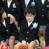 Kai waiting for the group photo to be taken at his kindergarten graduation