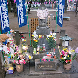 Mizugo Kosodate Jizobosatsu, in front of the Renkei Temple. Buddha statues like this are often donated to temples, in memory of children who died.