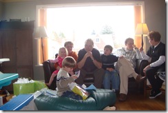 Clara, Grandma, Grandpa, Quinn, Jeff and GG watching Kal open presents