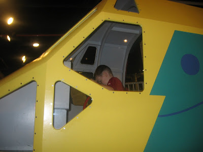 BigE in the pilot seat of a helicopter mockup