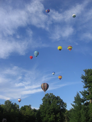 Hot air balloons floating away
